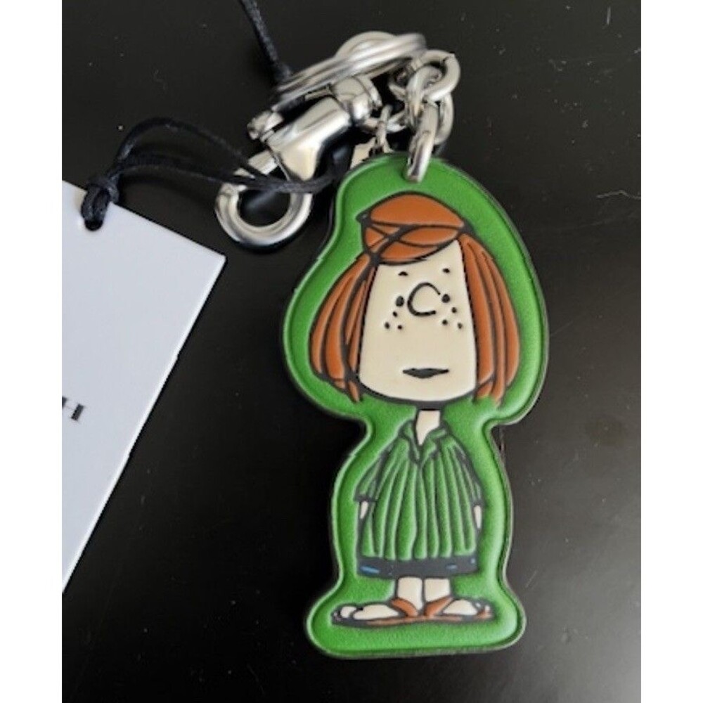 Coach x Peanuts Peppermint Patty Bag Charm Keychain CBG58 75th Anniversary NWT - Picture 1 of 2